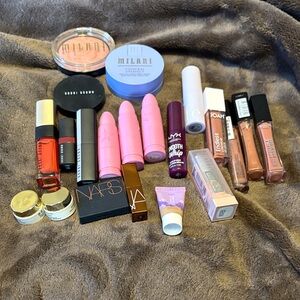 Lot of 22 makeup products brand name and unused! Comes in cute makeup bag